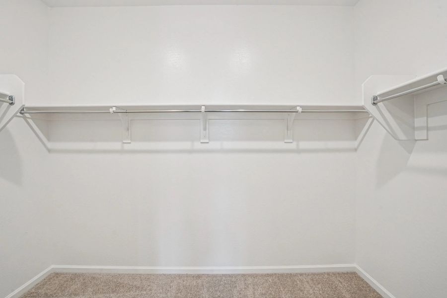 Primary walk in closet Primary walk in closet
