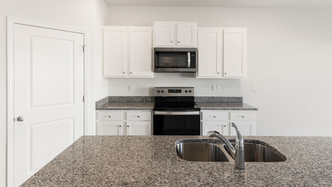 Representative furnished interior of a home built from the HAYDEN by D.R. Horton in Sidbury Station, Castle Hayne (Image 6).