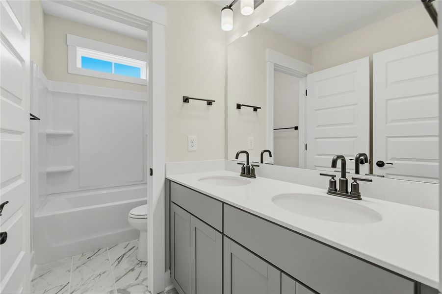 Clean lines and a spacious dual vanity define this