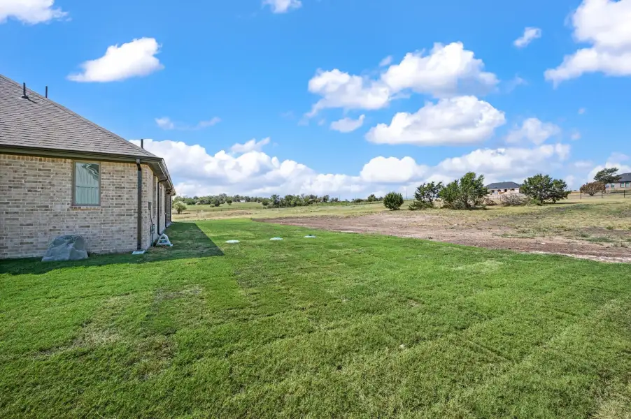 Exterior details and patio area of a home in Gatlin Ranch, Springtown (Image 20).