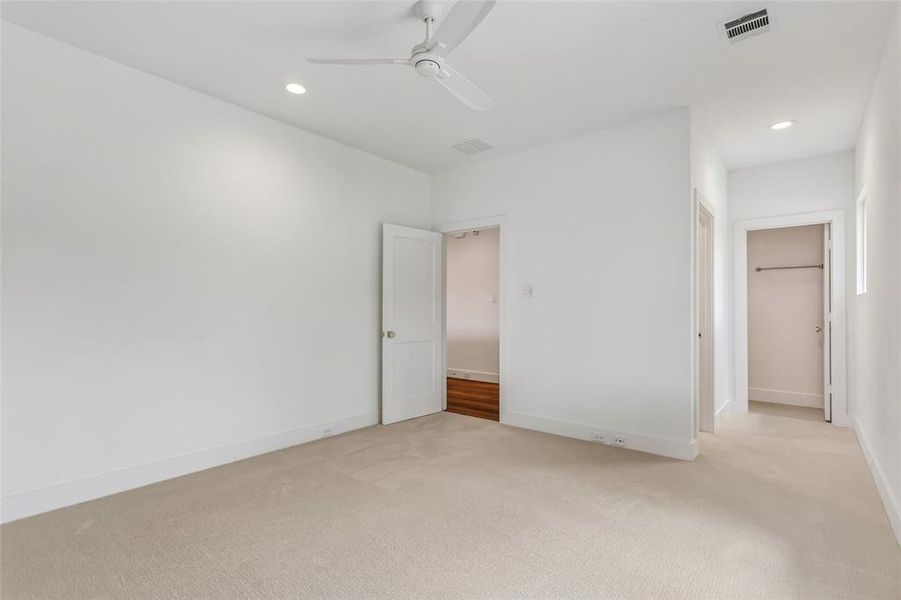 Bedroom 4 with view of walk in closet and ensuite bathroom