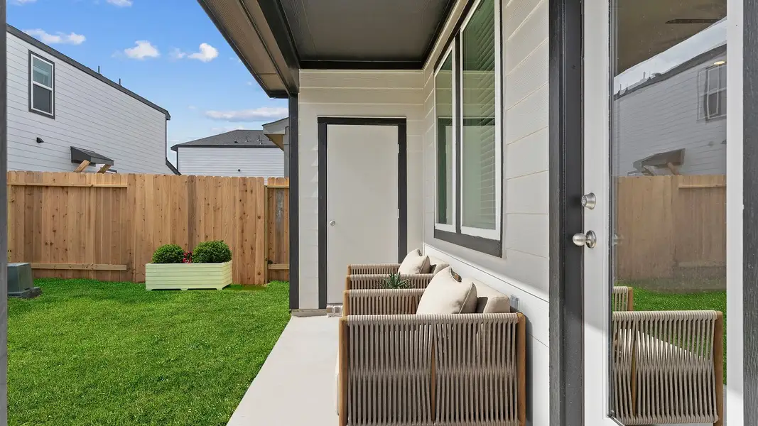 Front exterior of a new home in Lexington Village, Missouri City, TX, highlighting curb appeal (Image 2).