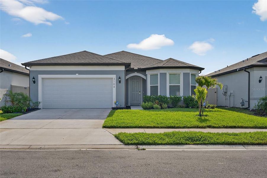 Front exterior of a new home in , Ellenton, FL, highlighting curb appeal (Image 28).