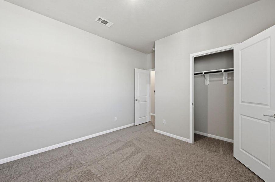 Neutral-toned carpeting and light gray wall paint create a versatile interior Neutral-toned carpeting and light gray wall paint create a versatile interior
