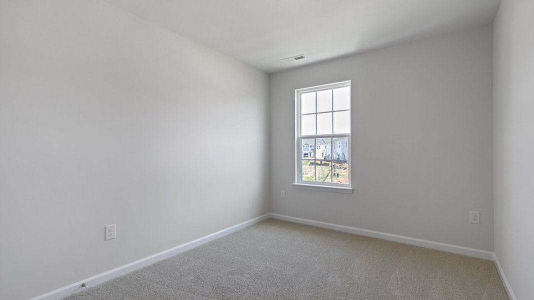 Spacious, unfurnished interior of a new home in The Townes at Bexford, Willow Spring (Image 15).