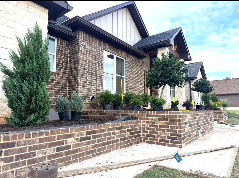 Front exterior of a new home in , Tyler, TX, highlighting curb appeal (Image 6).