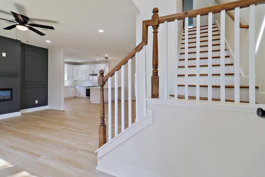 As you enter this home, the foyer is flanked by the stairway leading upstairs and the grand living room.