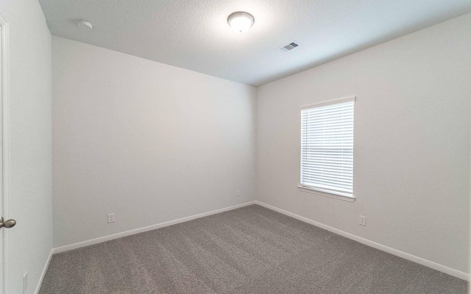 Spacious, unfurnished interior of a new home in The Pines at Seven Coves, Willis (Image 10).