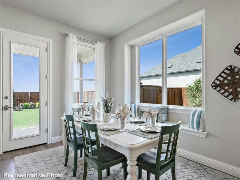 Bright dining area featuring a built-in window bench