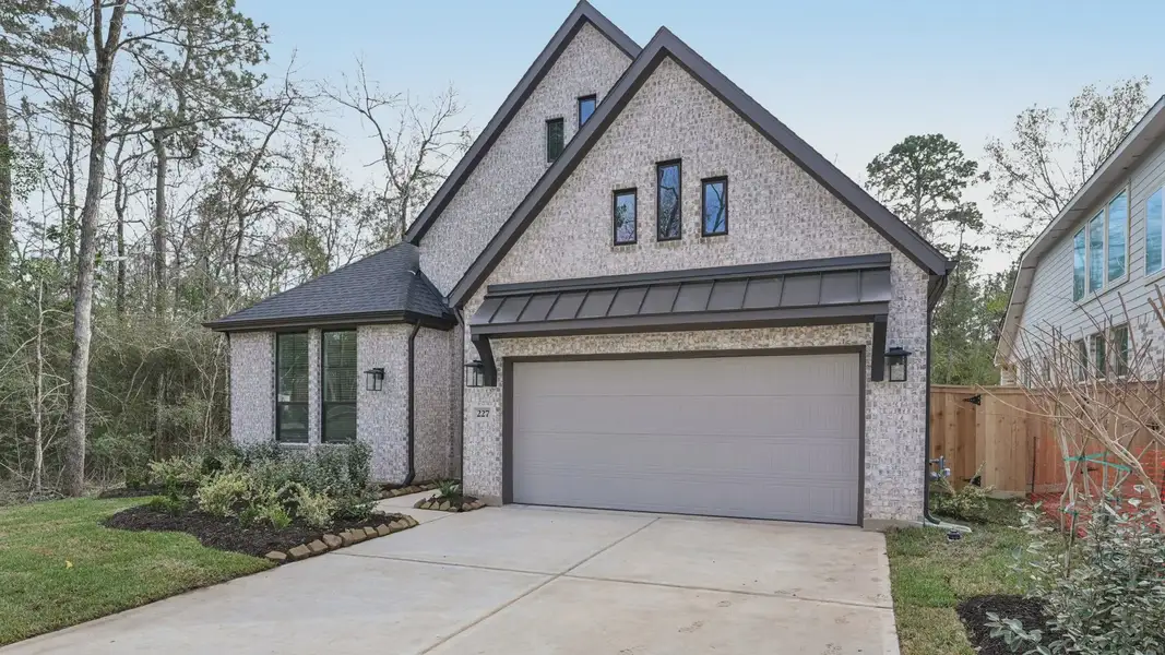 Representative exterior photo of a completed home built from the Summerton by Chesmar Homes in Audubon, Magnolia, TX (Image 2). Representative exterior photo of a completed home built from the Summerton by Chesmar Homes in Audubon, Magnolia, TX (Image 2).