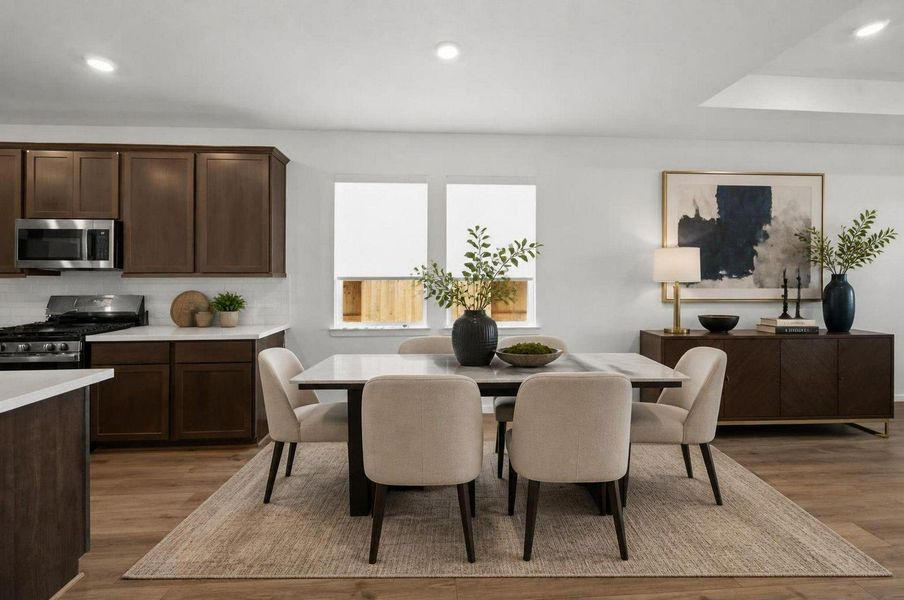 The dining area sits naturally beside the kitchen and living room, creating one connected main living space. The open layout keeps meals, hosting, and everyday routines easy to enjoy. Virtually staged. The dining area sits naturally beside the kitchen and living room, creating one connected main living space. The open layout keeps meals, hosting, and everyday routines easy to enjoy. Virtually staged.