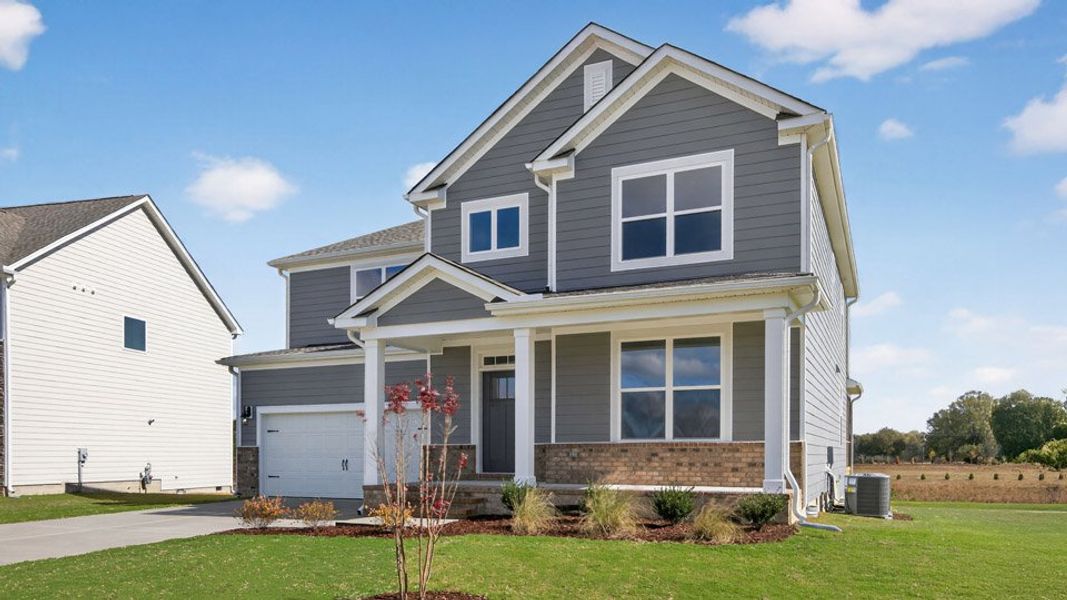 Representative exterior photo of a completed home built from the Jordan by D.R. Horton in Eagle Creek, Fuquay Varina, NC (Image 24). Representative exterior photo of a completed home built from the Jordan by D.R. Horton in Eagle Creek, Fuquay Varina, NC (Image 24).