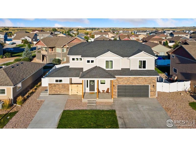 Front exterior of a new home in , Wellington, CO, highlighting curb appeal (Image 26).