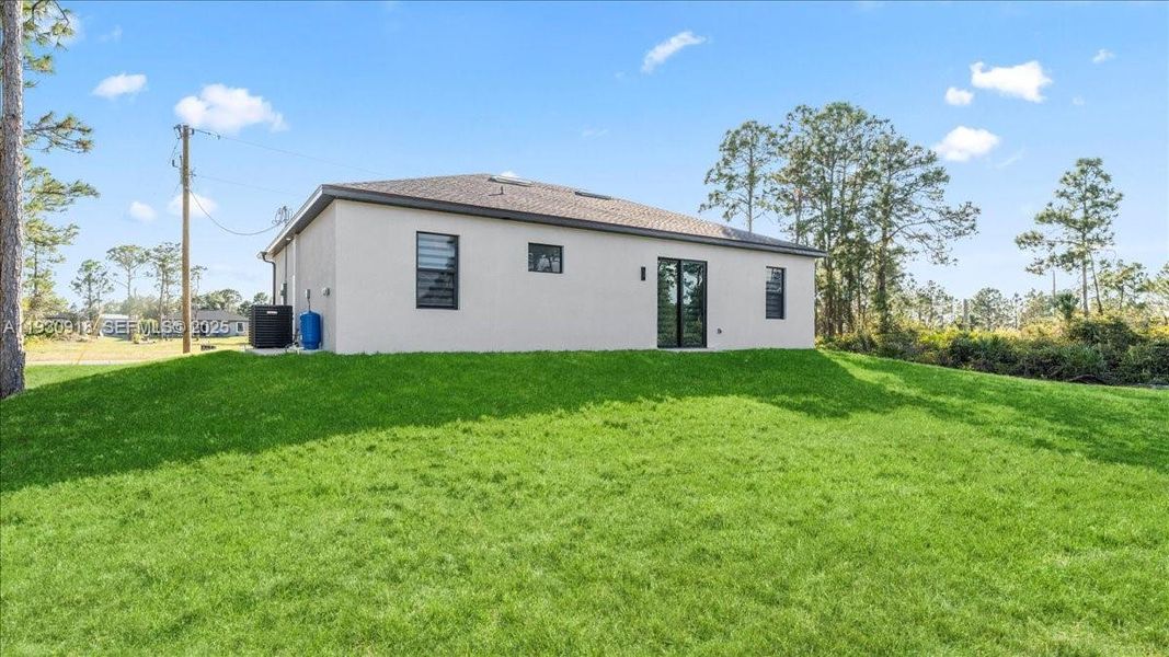 Exterior details and patio area of a home in , Lehigh Acres (Image 3). Exterior details and patio area of a home in , Lehigh Acres (Image 3).