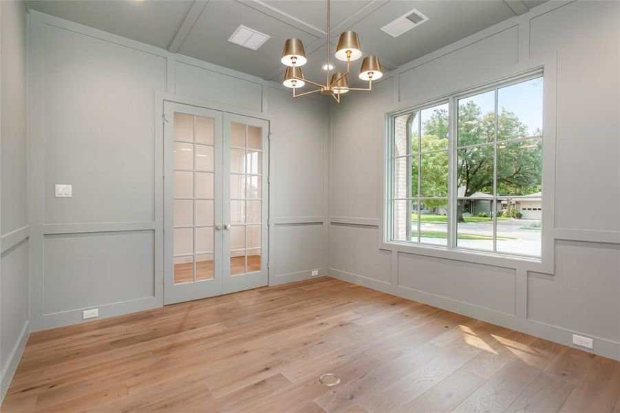 Well lit, paneled office space withe French doors for privacy