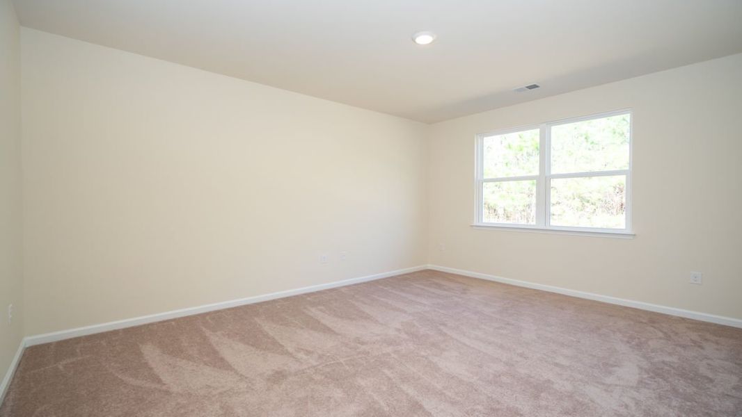 Representative unfurnished interior of a home built from the CALI by D.R. Horton in The Reserve at Wild Horse, Conway (Image 27).