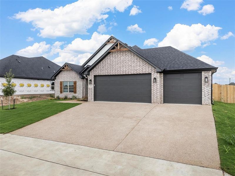 View of front of house featuring driveway, an attached garage, brick siding, and roof with shingles View of front of house featuring driveway, an attached garage, brick siding, and roof with shingles