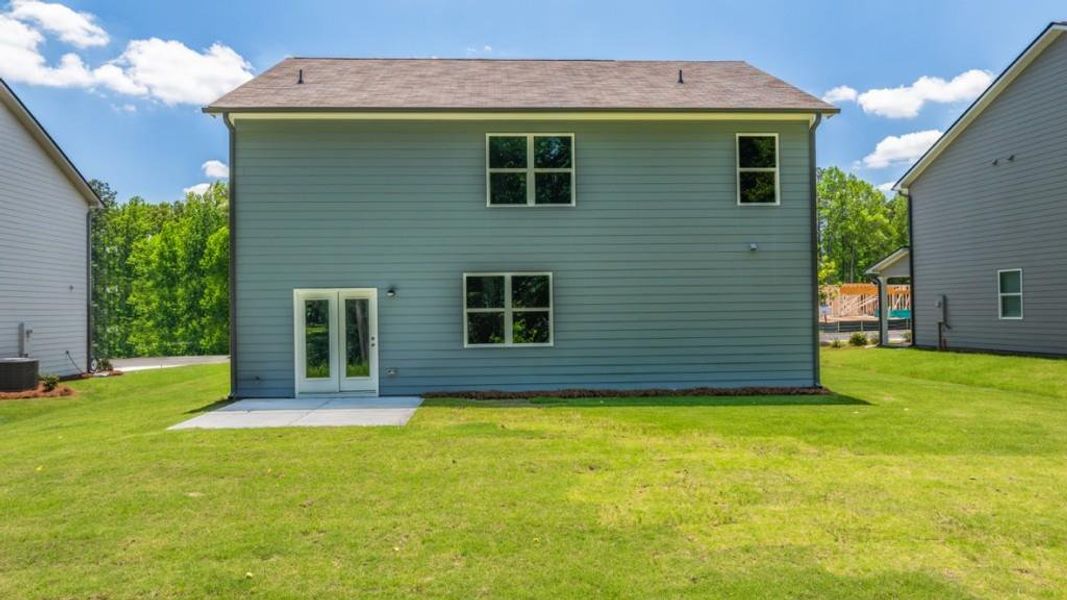Exterior details and patio area of a home in Northwoods at Mirror Lake, Villa Rica (Image 3).