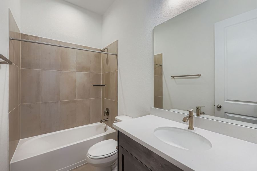 Furnished interior view inside a new home in 6 Creeks, Kyle (Image 5).