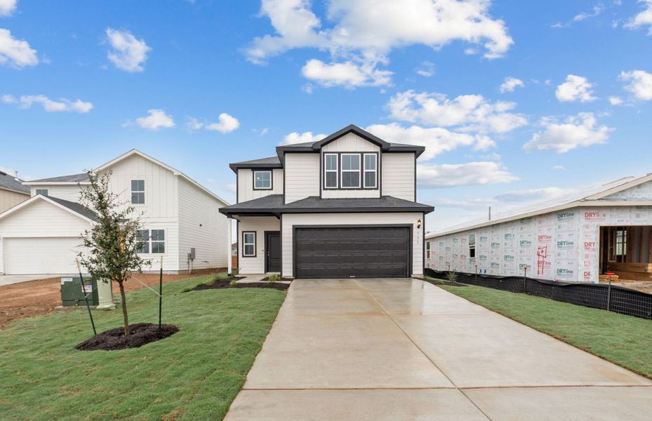 Front exterior of a new home in Larson Crossing, Elgin, TX, highlighting curb appeal (Image 18).