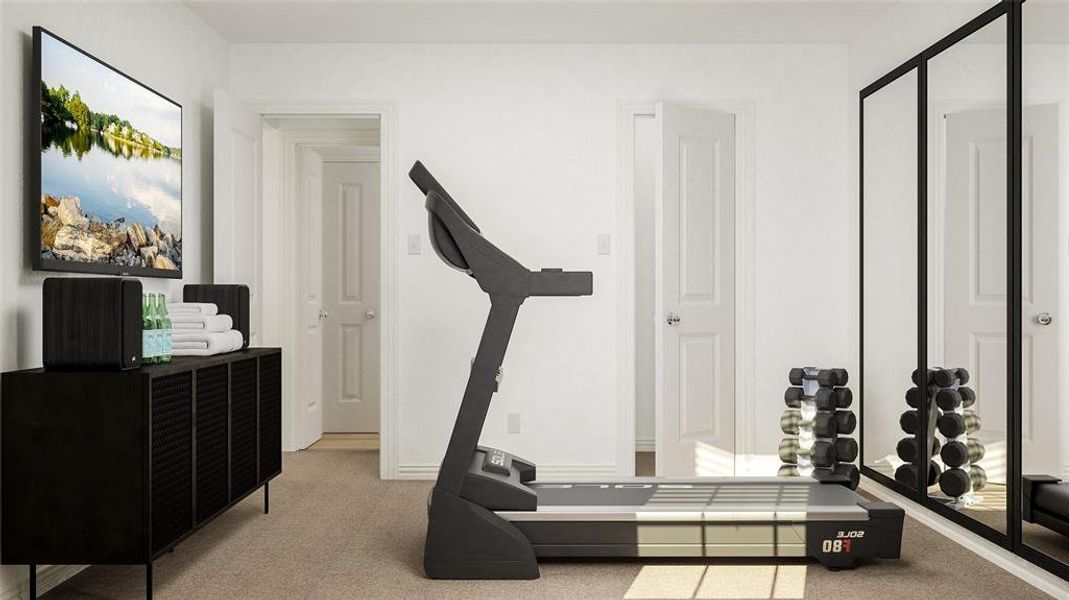 Workout room featuring light carpet