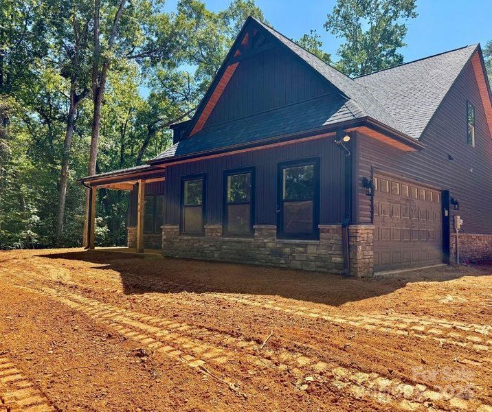 Front exterior of a new home in , Mount Gilead, NC, highlighting curb appeal (Image 11).