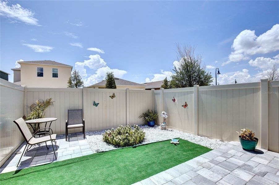 Exterior details and patio area of a home in Windrose, Apopka (Image 4).