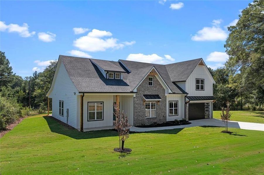Front exterior of a new home in , Powder Springs, GA, highlighting curb appeal (Image 34).