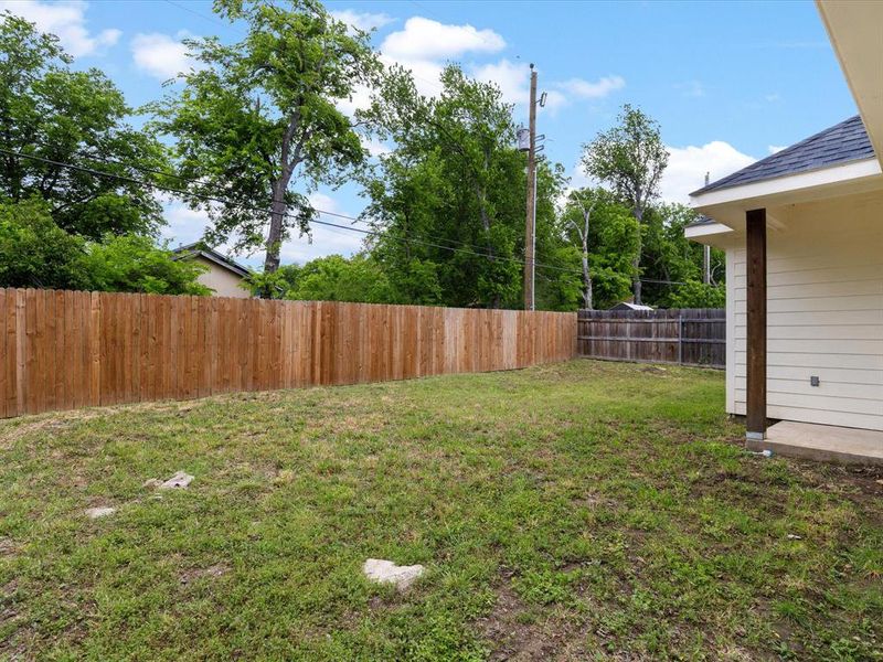 Fenced backyard featuring a patio area