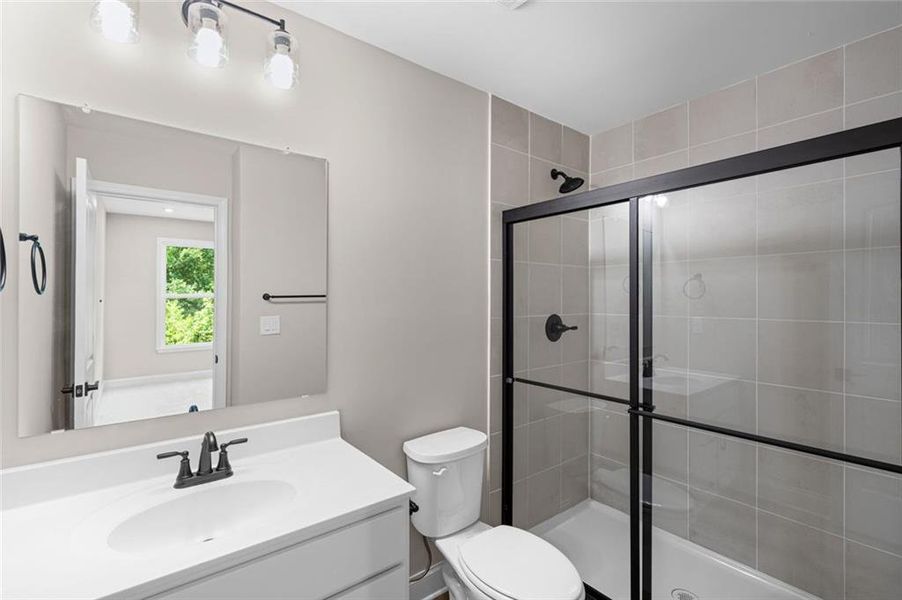 Furnished interior view inside a new home in Hidden Fields, Hoschton (Image 12).