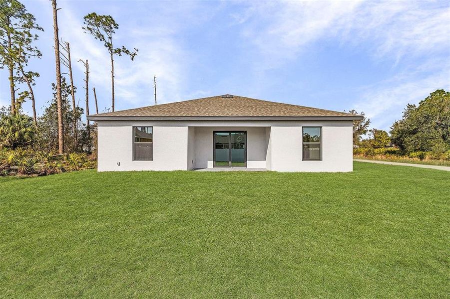 Front exterior of a new home in , North Port, FL, highlighting curb appeal (Image 13). Front exterior of a new home in , North Port, FL, highlighting curb appeal (Image 13).