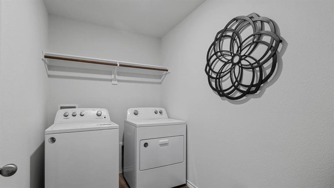 Laundry room featuring baseboards and washing machine and clothes dryer Laundry room featuring baseboards and washing machine and clothes dryer