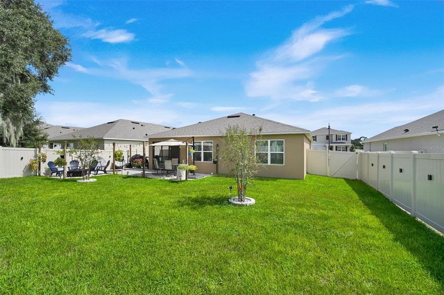 Exterior details and patio area of a home in Windrose, Apopka (Image 4).