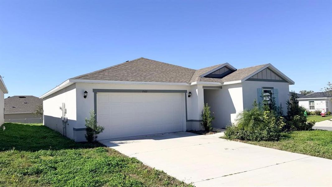 Front exterior of a new home in Lake Lucerne, Winter Haven, FL, highlighting curb appeal (Image 20).