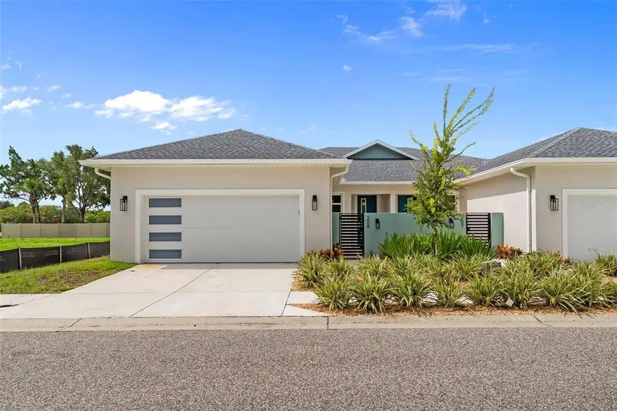 Front exterior of a new home in , Tarpon Springs, FL, highlighting curb appeal (Image 27).