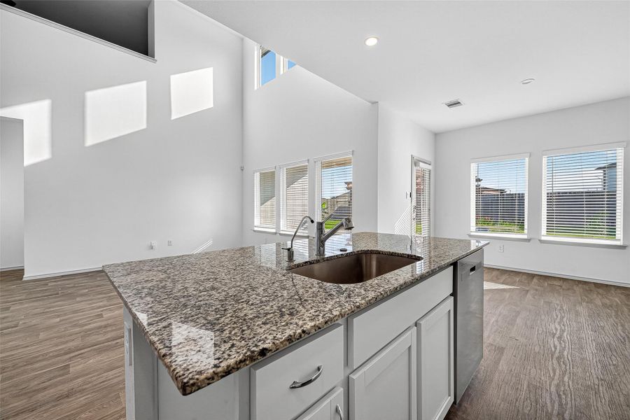 The open concept living area includes a beautiful kitchen island.