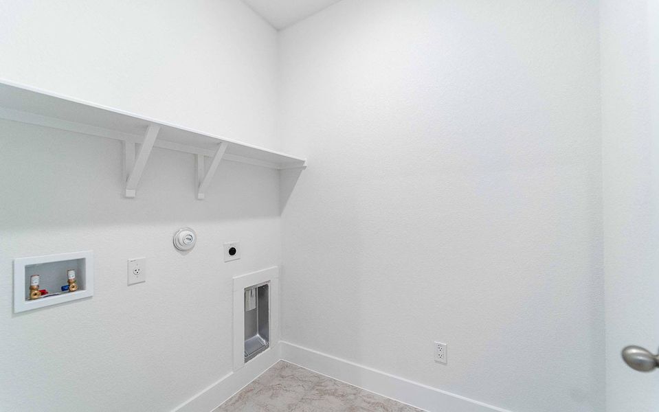 Laundry room featuring washer hookup, hookup for a gas dryer, and hookup for an electric dryer Laundry room featuring washer hookup, hookup for a gas dryer, and hookup for an electric dryer
