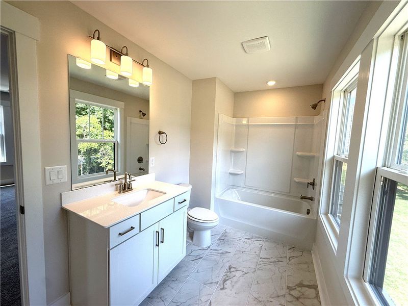 A well-lit bathroom with ample natural light offer A well-lit bathroom with ample natural light offer
