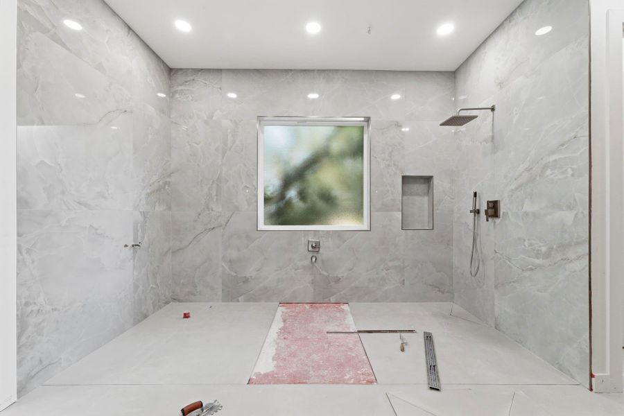 Floor to ceiling porcelain tiles, high-end fixtures, and a soaking tub will be featured in the wet room. Floor to ceiling porcelain tiles, high-end fixtures, and a soaking tub will be featured in the wet room.