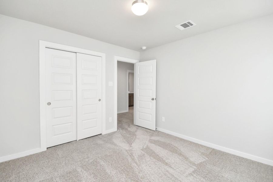 Generously sized secondary bedrooms, complete with spacious closets and soft,inviting carpeting. Enjoy abundant natural light streaming in through the largewindows, complemented by privacy blinds for your personal sanctuary. Sample photo of completed home with similar floor plan. Actual colors and selections may vary.