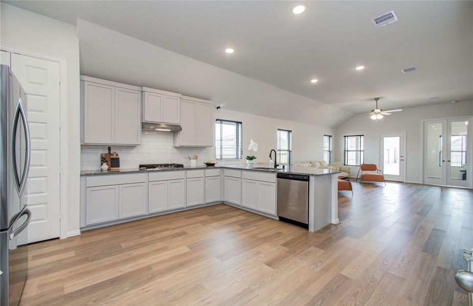 Furnished interior view inside a new home in Sunterra, Katy (Image 23).
