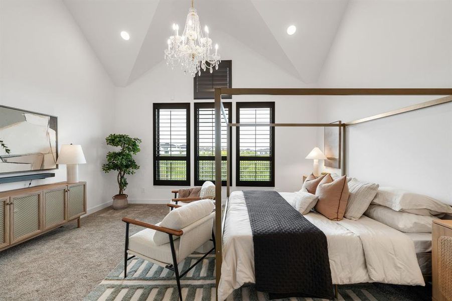 Bedroom with carpet flooring, recessed lighting, high vaulted ceiling, and a chandelier Bedroom with carpet flooring, recessed lighting, high vaulted ceiling, and a chandelier