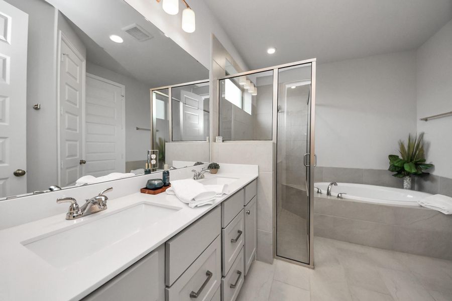 Relax after a long day in this tranquil, spa-like bathroom.  Oversized shower, and large tub gives plenty of choices for relaxation.  Dual vanities and great storage space.