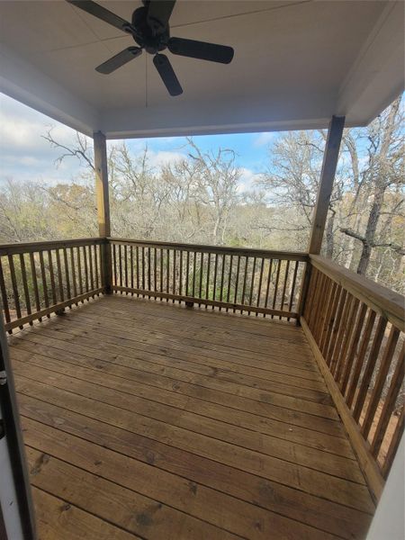 Wooden deck featuring ceiling fan