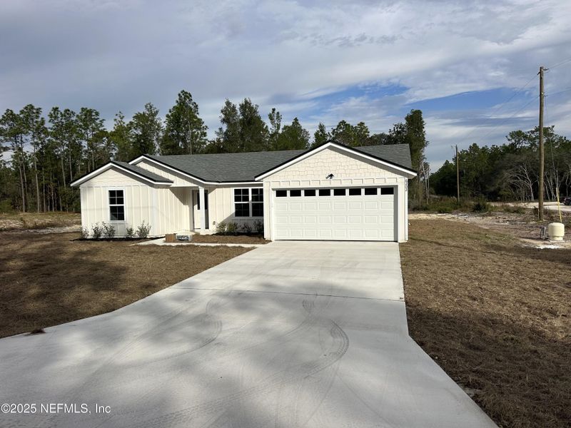 Front exterior of a new home in , Keystone Heights, FL, highlighting curb appeal (Image 1). Front exterior of a new home in , Keystone Heights, FL, highlighting curb appeal (Image 1).