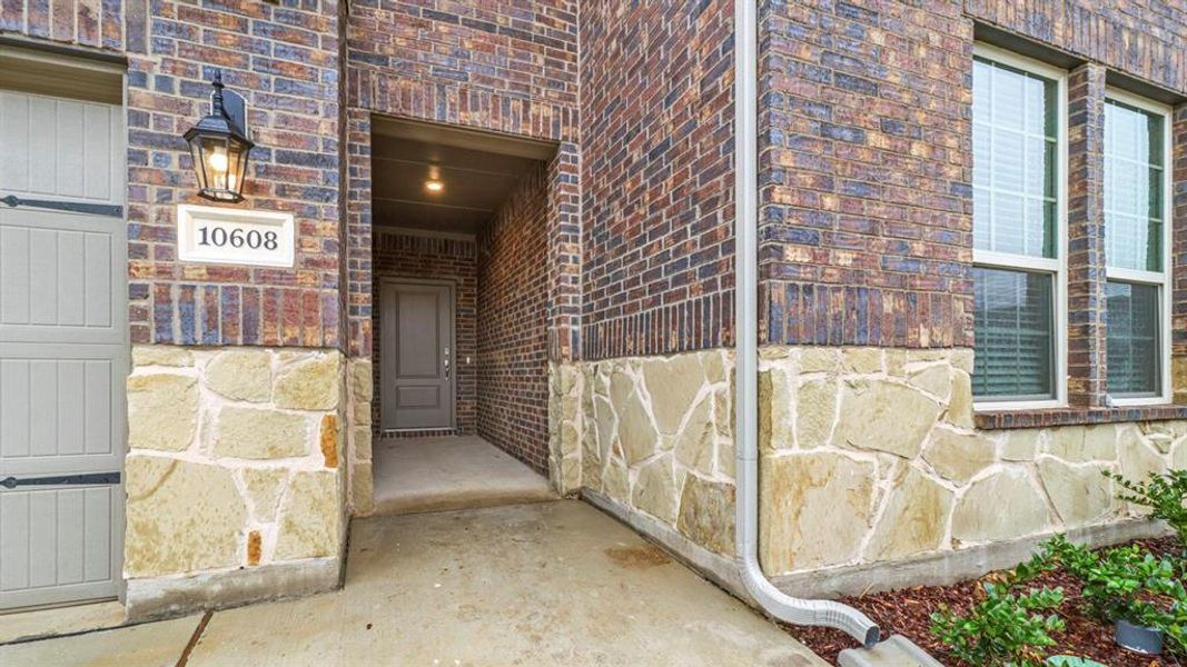 View of exterior entry featuring brick siding View of exterior entry featuring brick siding
