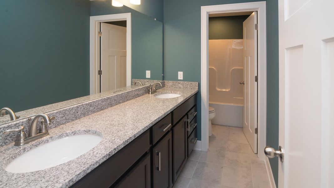 Representative furnished interior of a home built from the The Hartland by Norfolk Homes in Coronado Estates, Jackson (Image 20).