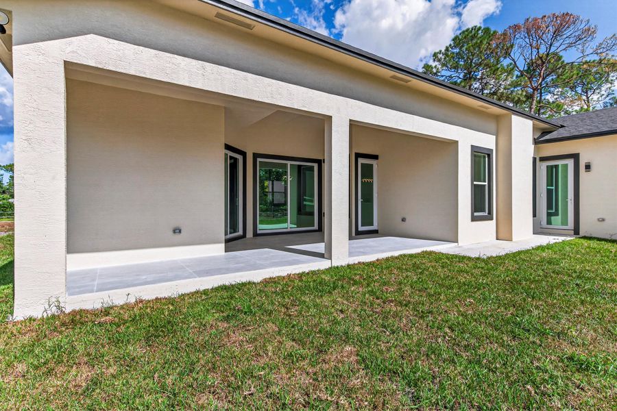 Exterior details and patio area of a home in , The Acreage (Image 4). Exterior details and patio area of a home in , The Acreage (Image 4).