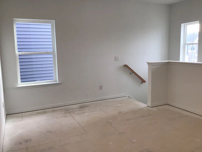 Loft featuring the AW Collection® Coastal - Flexible open space filled with natural light.