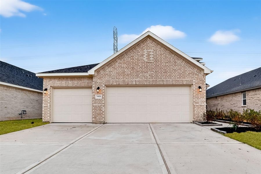 Front exterior of a new home in Rollingbrook Estates, Baytown, TX, highlighting curb appeal (Image 24).
